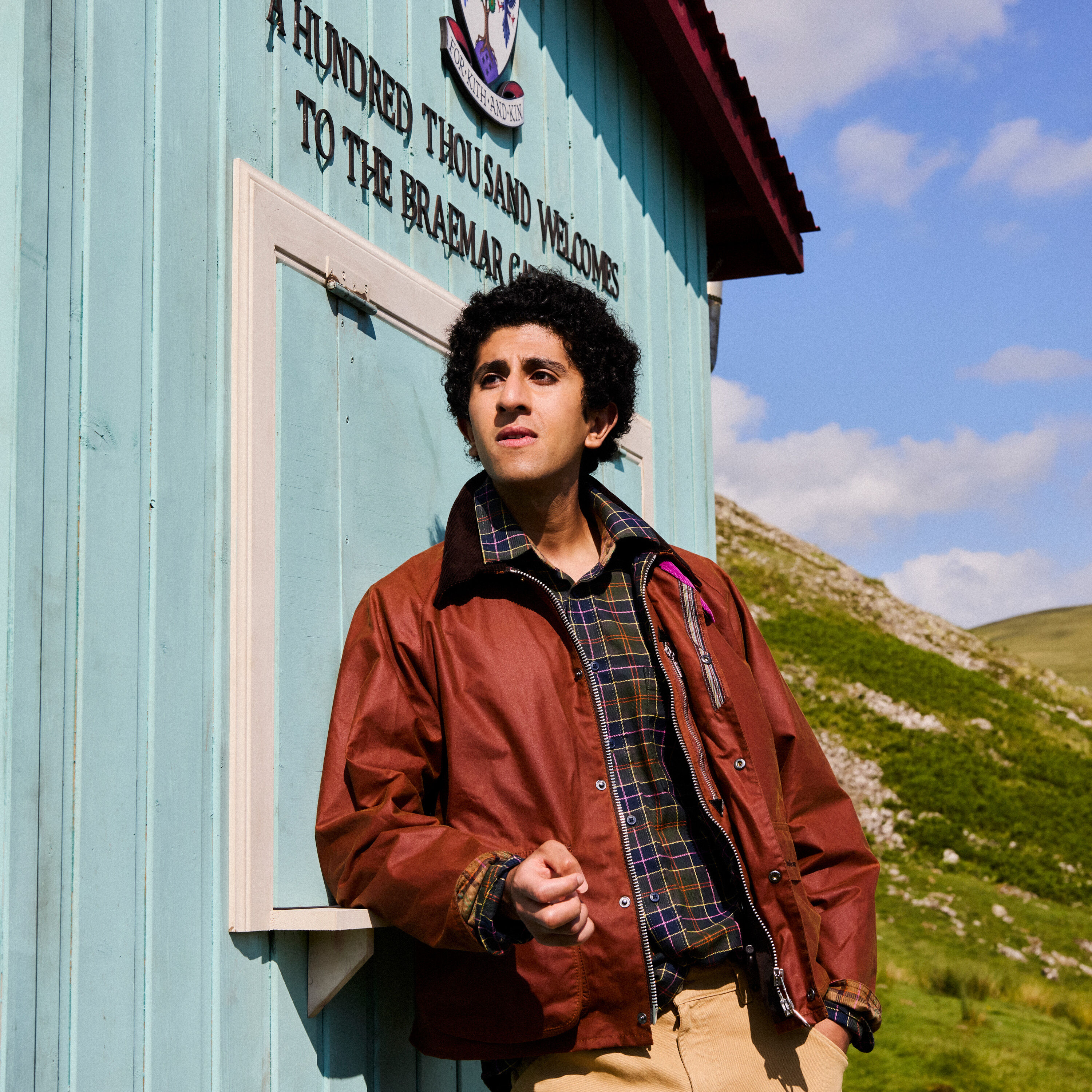 Man wearing Barbour x Paul Smith Key Transport Wax Jacket in Russet