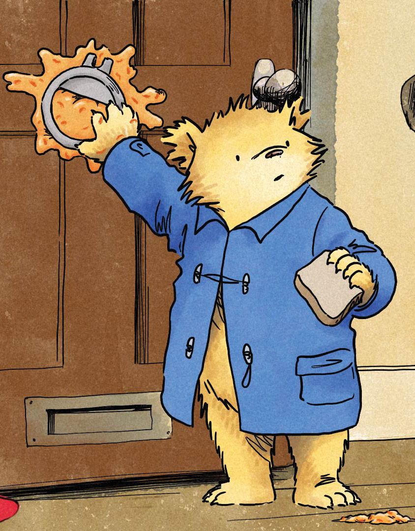 Paddington tries to stick Mr Curry's door knocker back on with marmalade