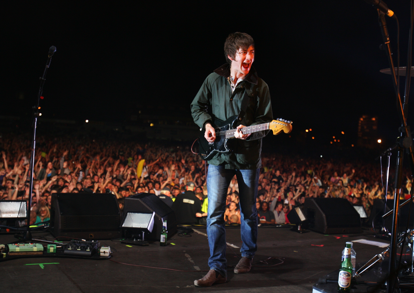 Arctic Monkey, Alex Turner, wearing Barbour jacket on stage