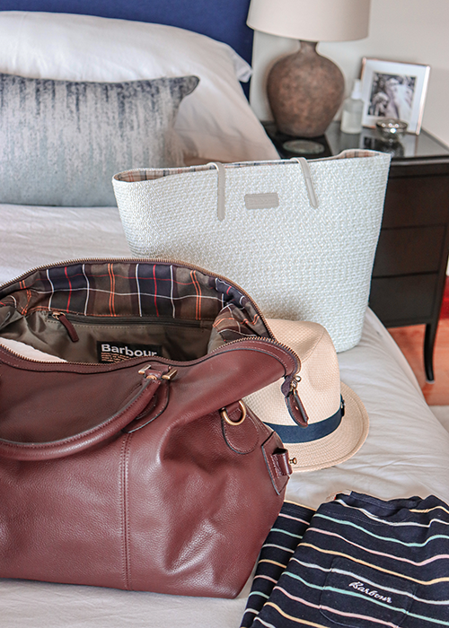 Sarah-Jane packs the SS21 Womens Summer Shop collection in her Leather Explorer bag